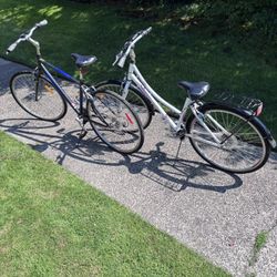 2 Road Bikes - Blue and White, with gears and road wheels. 