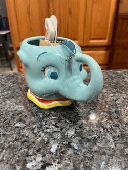 Disney Dumbo Mug with Timothy Mouse Spoon .  Brand new with tags.  Perfect condition.  Really cute.  Smoke free home