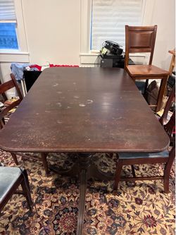 Antique (used) solid-as-a-rock dining table with Rosewood chairs!