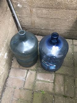 Two 5 Gallon Plastic Bottles