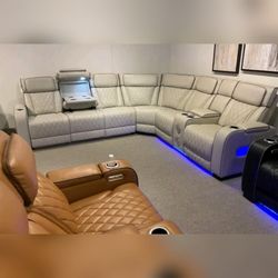 Taupe faux leather  Power Reclining Sectional w/ Consoles Power Headrests Storage Arms Cup holders Charging Ports Wireless speakers &LED lighting