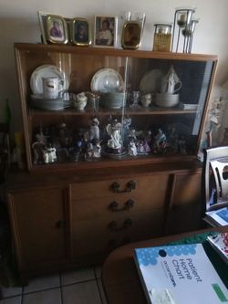 China cabinet with dishes and whatnots