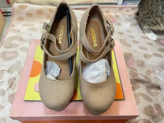 Beige Mary Jane’s heels