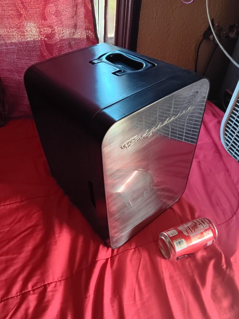 Small fridge refrigerator 13 soda cans capacity.