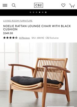 Noelie rattan lounge chair with black cushion deals