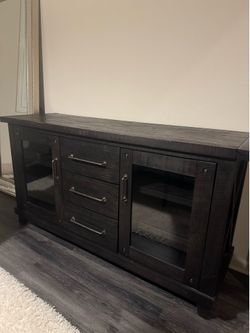 Black living spaces cabinet with glass door