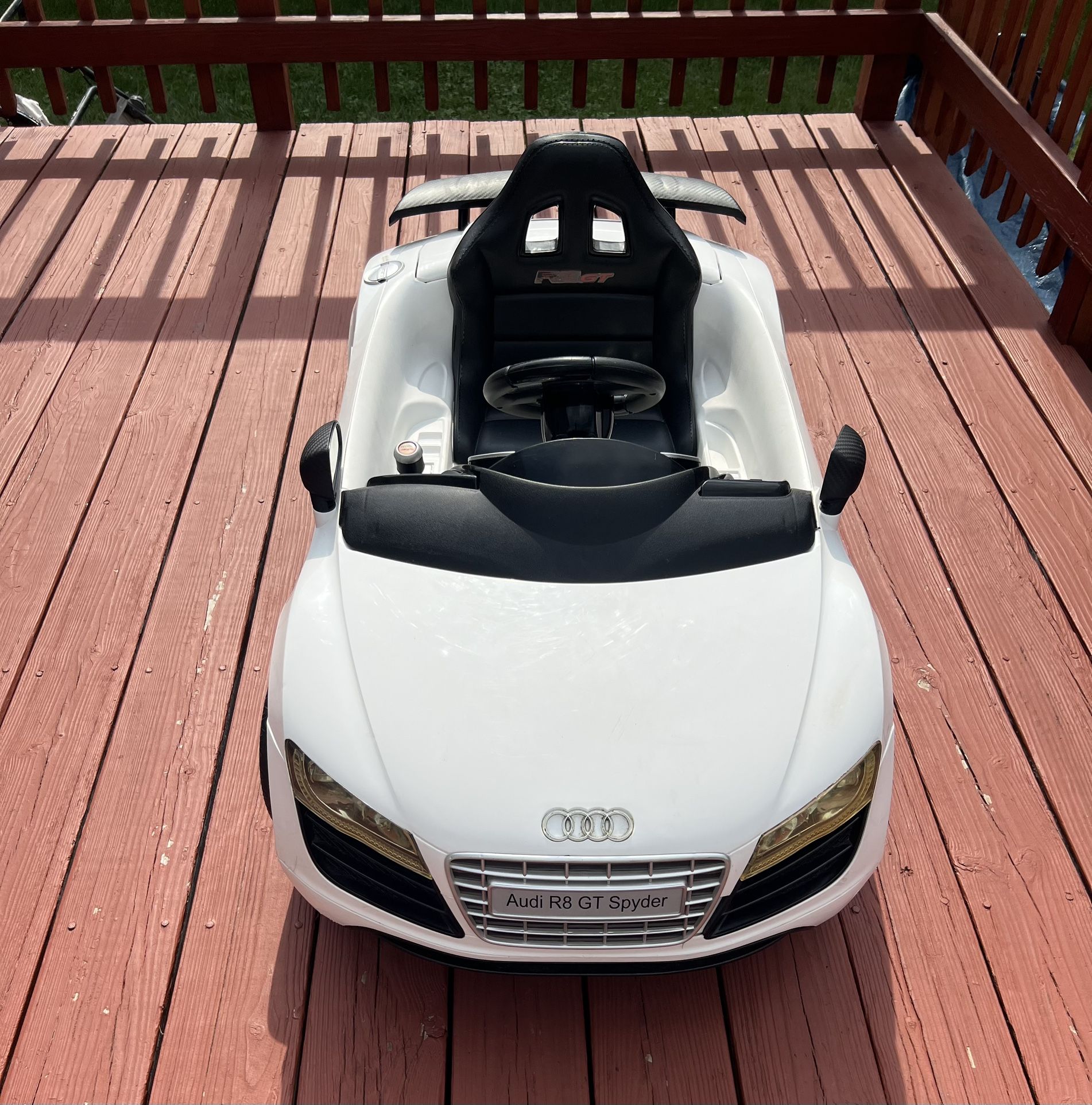 White Audi R8 GT Spyder ride-on toy car for kids