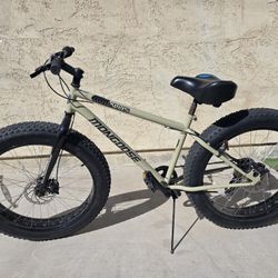 Mongoose Malus Mountain Bike/Road Bike With Fat Tires And 26 Inch Wheels 