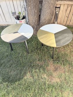 Two nice tables in good condition, $15 each.