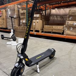 Electric scooters with front and rear shock absorbers