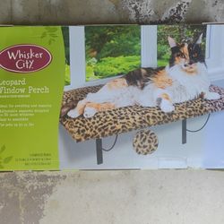 Brand new cat window perch securely mount in place. Leopard print size 23.75 L  14 W  10.5 H
