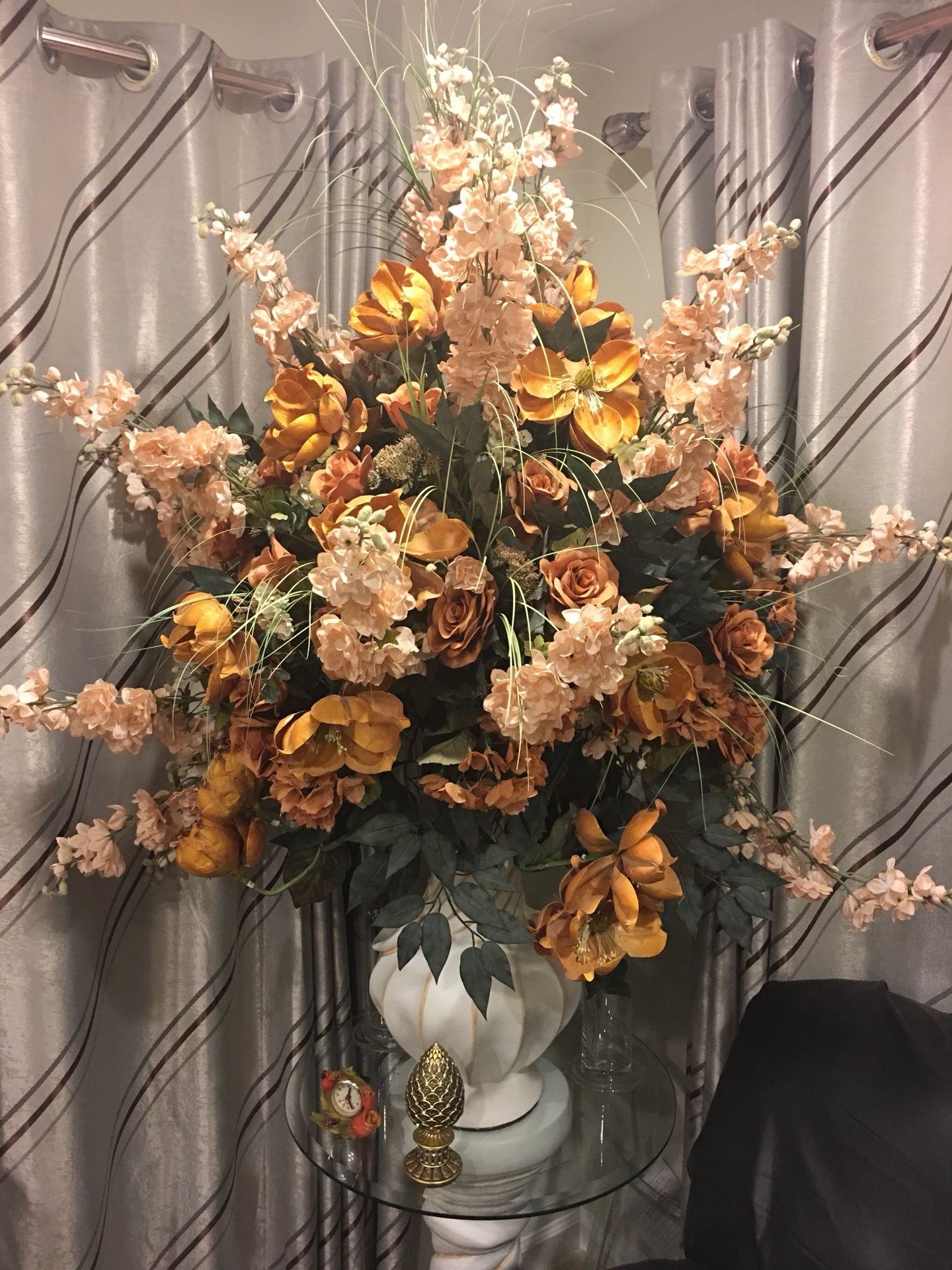 Beautiful flowers in a pot with glass base