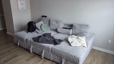 large light-gray ribbed/fluted chenille modular sectional / cloud couch