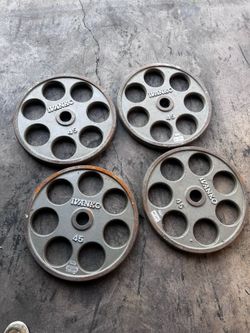 E-Z Lift Iron Olympic Revolver Plates with Round Hole Grips | Ivanko