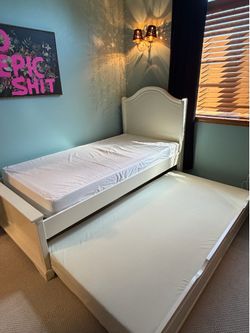 Twin bed with trundle and mattresses