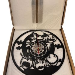 The Nightmare Before Christmas themed vinyl record wall clock featuring Jack Skellington and pumpkins. 