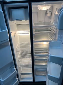 Ge black side by side refrigerator  -36" wide  -free delivery 