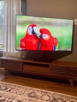 TLC 55” QLED TV with mounted steel stand
