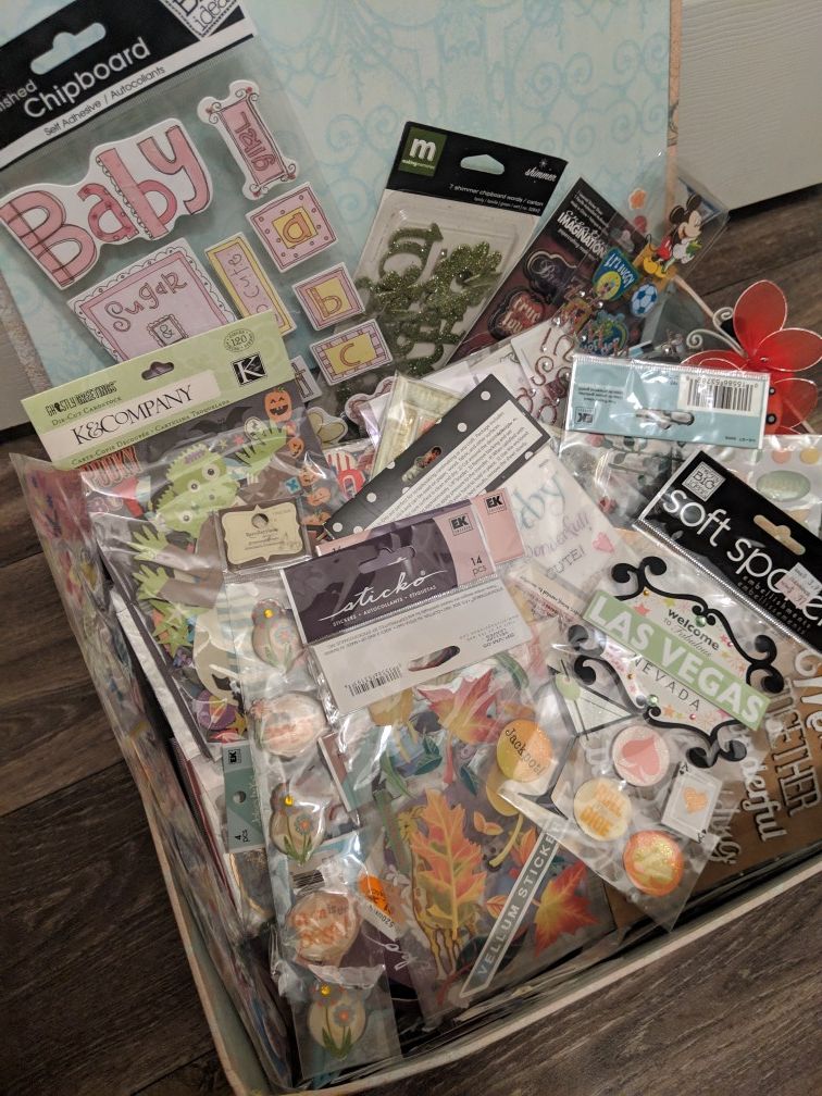 Scrapbooking box of stickers and embellishments