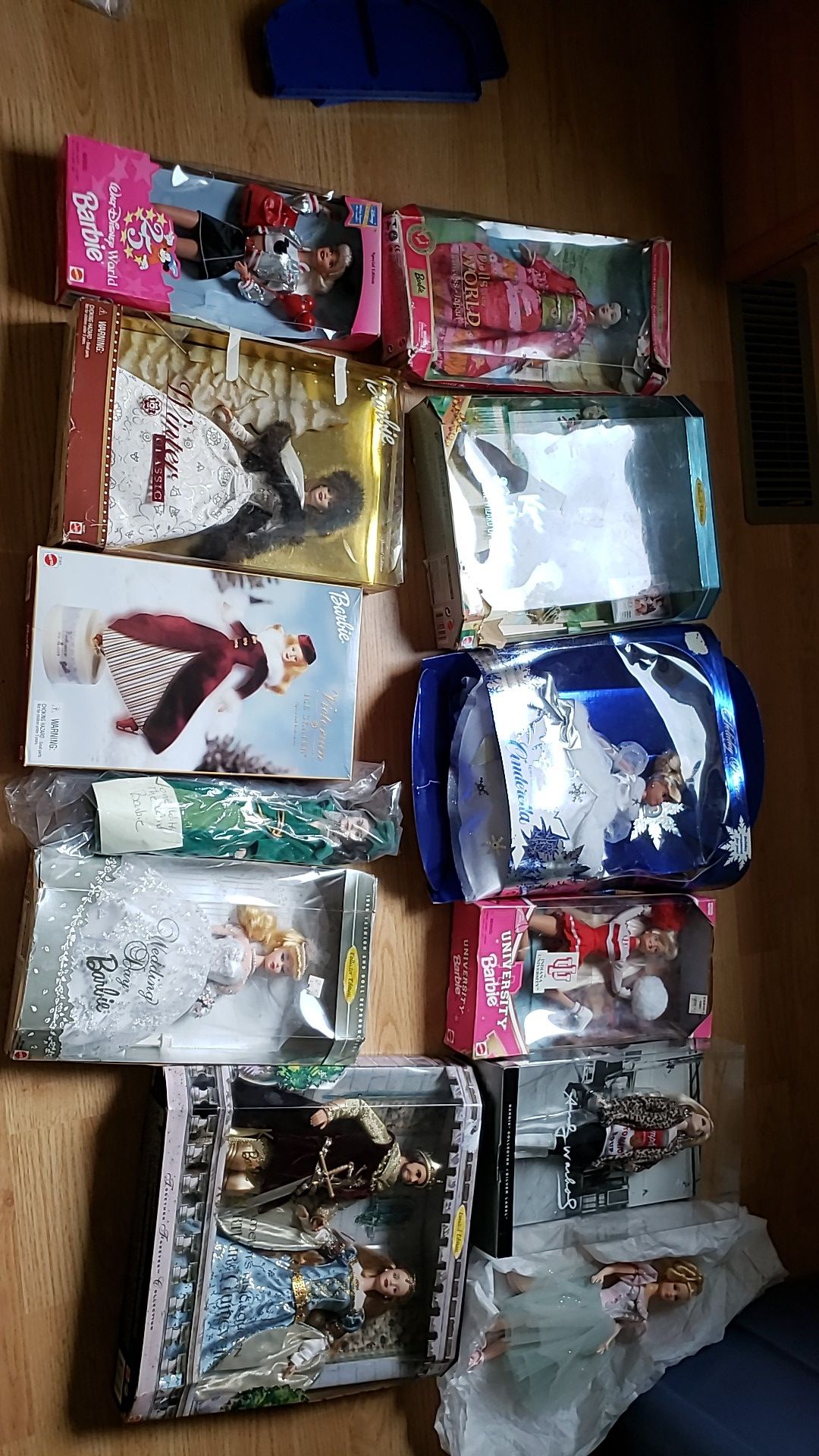 12 VINTAGE BARBIES, 10 IN ORIGINAL UNOPENED PACKAGES WITH TWO MORE ITEMS