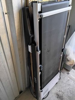 Portable treadmill and window air conditioner