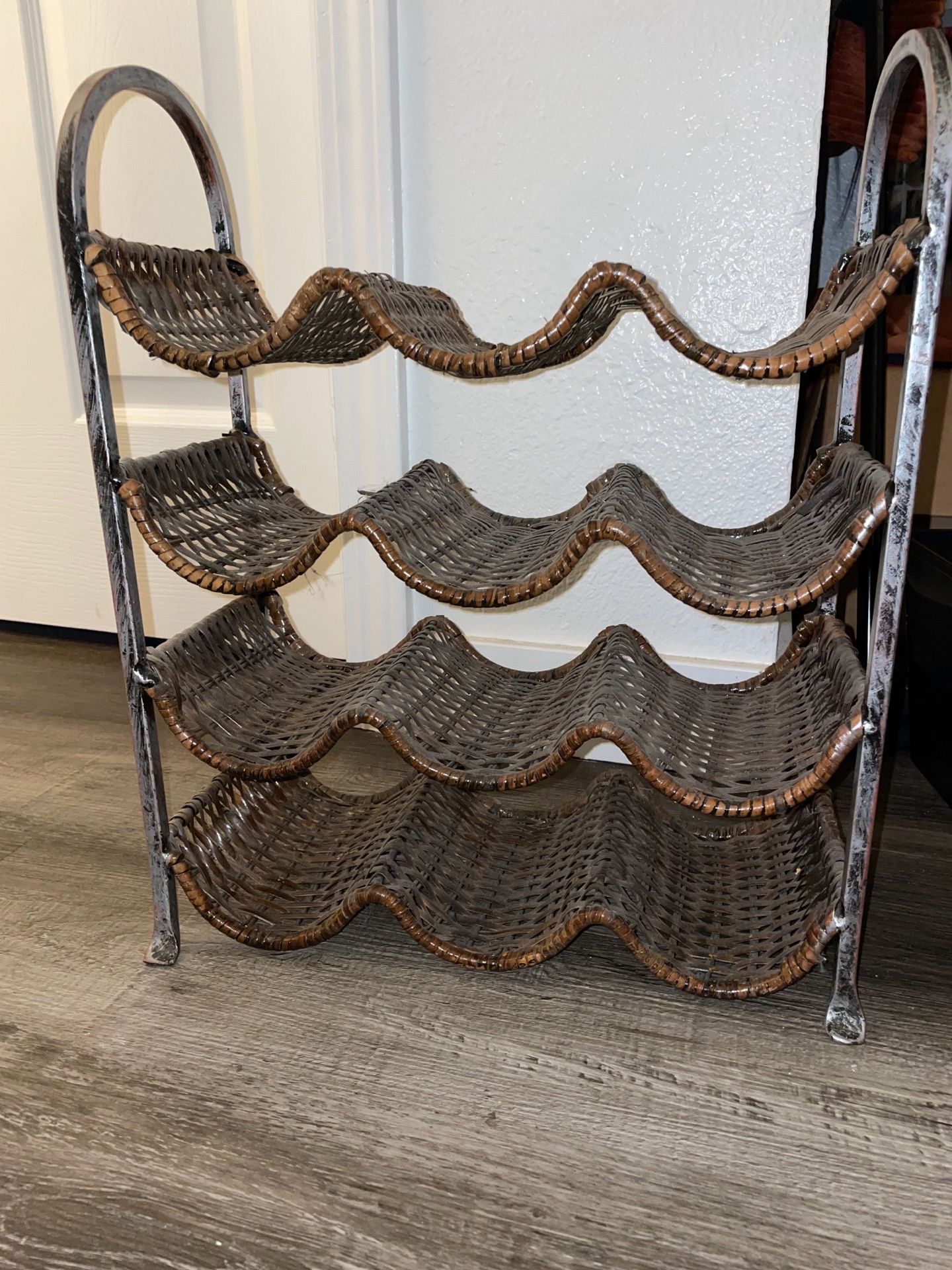 Vintage iron and wicker wine rack