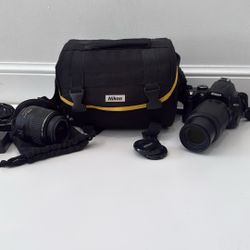 Nikon Camera With Case And Lens