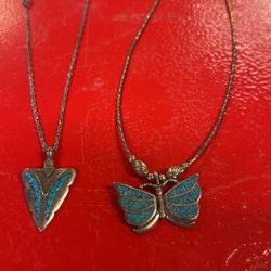 Two necklaces, silver with blue turquoise, arrowhead, and butterfly