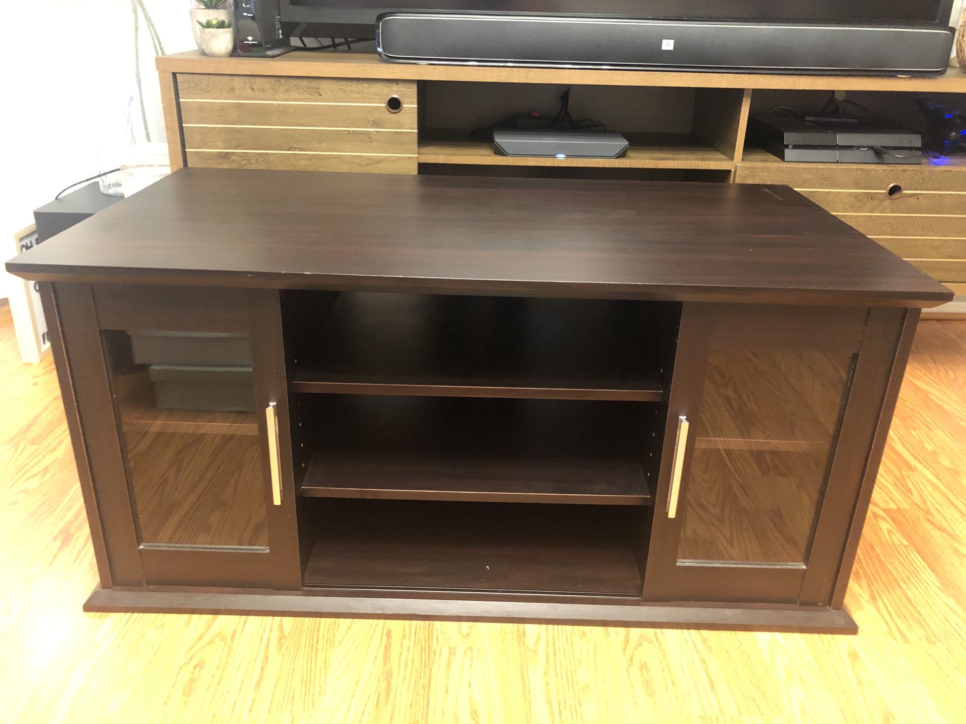 Brown entertainment/tv stand in mint condition