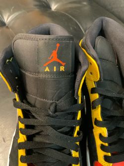 Jordan 1 Mid Black Amarillo Orange