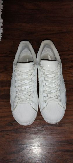 All white adidas super stars