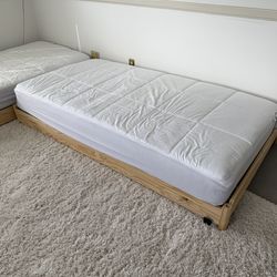 2 single Stackable beds with mattresses