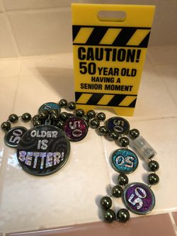 Turning 50 ? Party stuff .Necklace and cake decoration $5