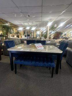 Brand new faux marble top and blue or gray and a bench dining set
