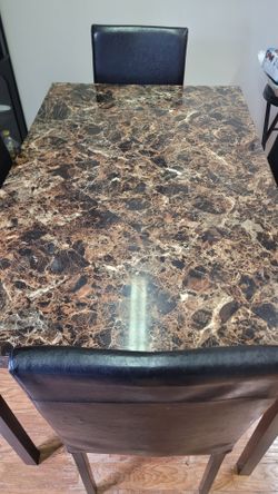 Table and 4 leather chairs