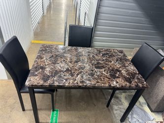 Table and three chairs
