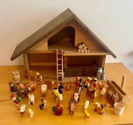 Wooden barn with animals and farm stuff
