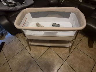 Infant bassinet with diaper shelf