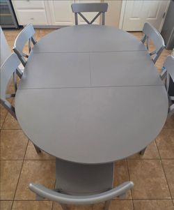Grey IKEA oval table set for 6