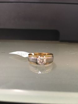 $3250.00platinum/18k with .0.75cts round Center  diamond