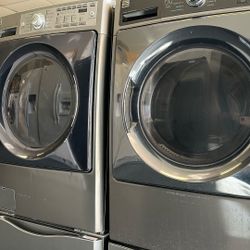 Front Load Kenmore Washer And Dryer Set On Pedestals 