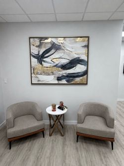 2 Modern two Tome Accent Barrel Chair, Pedestal Farmhouse Crossed Legs table, Gold abstract canvas decor.