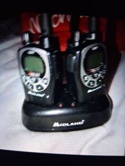 2 Midland walkie talkies and charger base