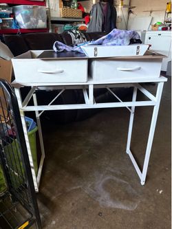 white desk with led strip on the bottom