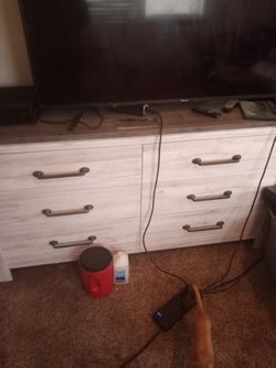 A Dresser That Has Six Drawers
