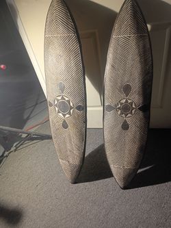 carved wooden decorative shields
