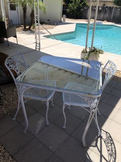 Antique iron table and two chairs