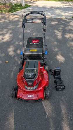 Like New Toro 22 inch battery and  self propelled lawn mower