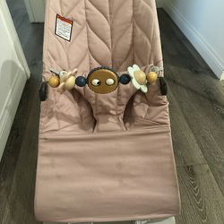 Pink Baby Bjorn Bouncer And Toy Bar 