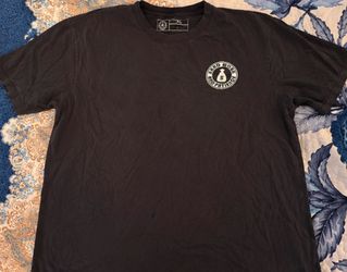 Black shirt. its a size large , has jeses